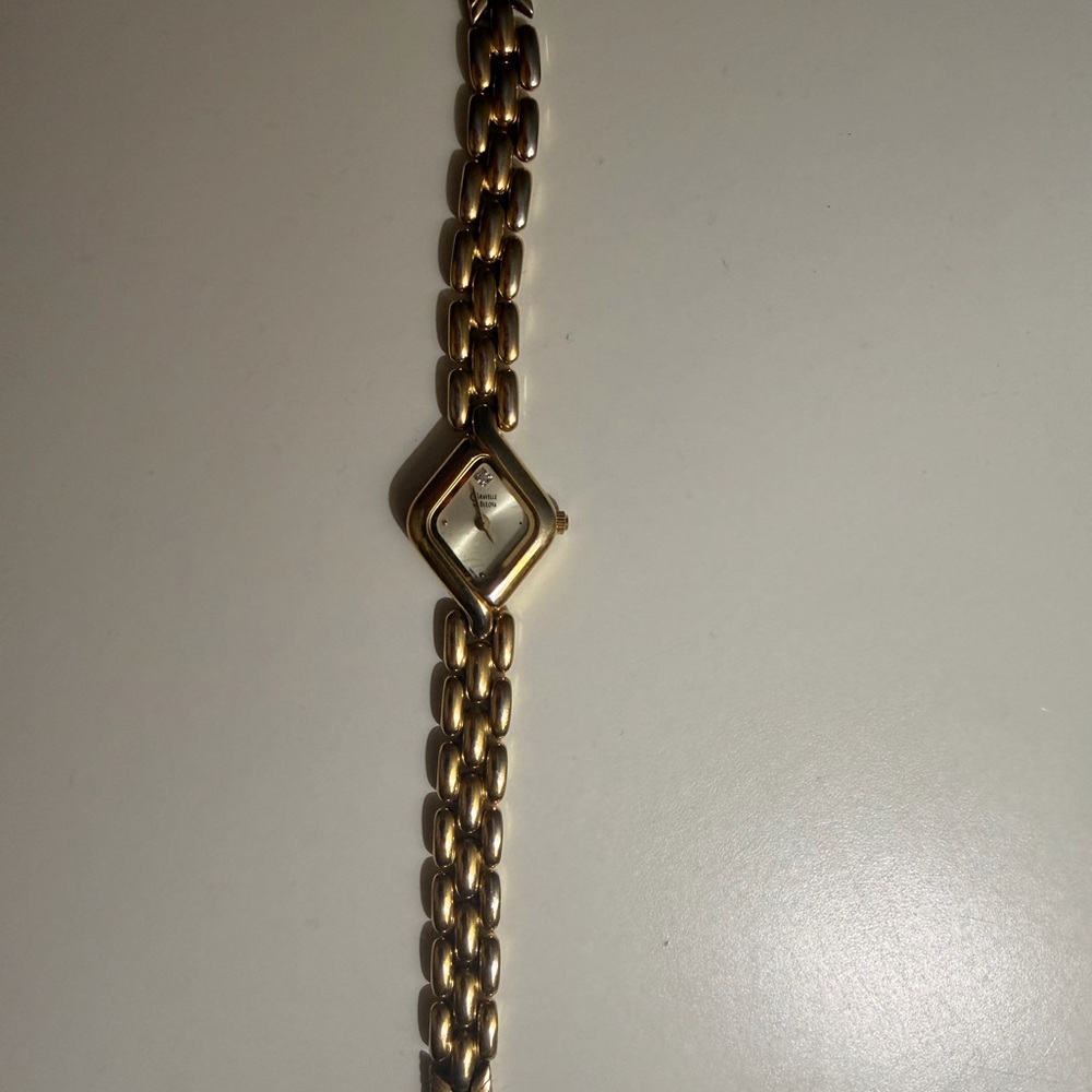 Vintage 1977 caravelle by Bulova ladies gold tone watch| diamond accent